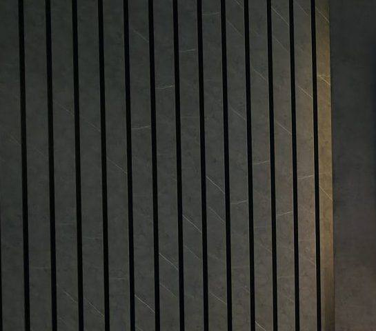 Close-up of dark marble-effect acoustic slat wall panelling