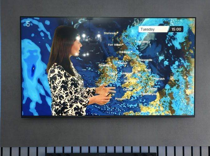 Wall-mounted TV on a media wall with every cable hidden from view