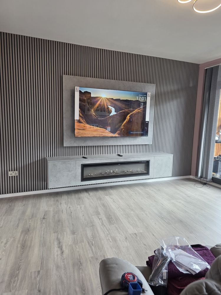 Wide view of the Clydebank Light Grey Chicago Concrete media wall, charcoal slats and long electric fire below the TV, by MPS Media Walls.