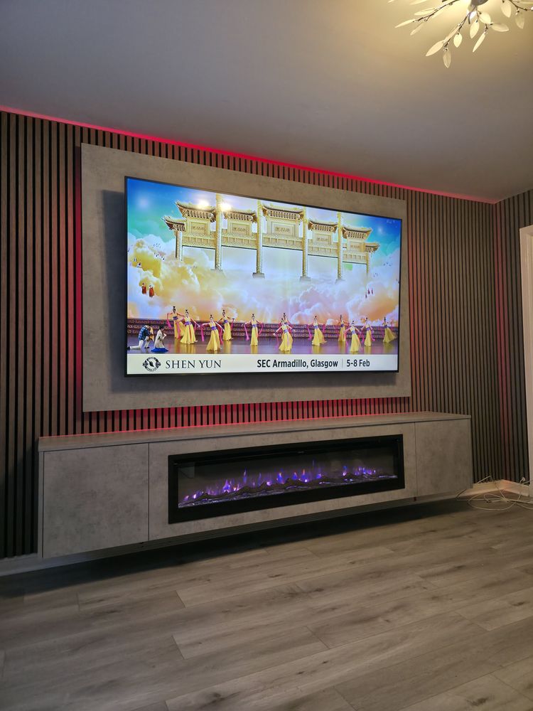 Light grey Chicago concrete cabinet and electric fire in Greenock with walnut slats and red LED glow, angled view, by MPS Media Walls.