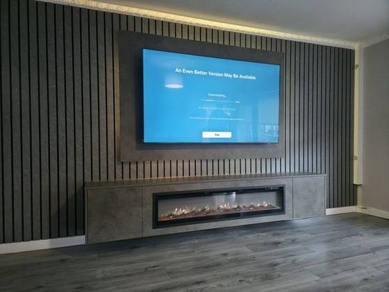 Dark marble slat wall with concrete-effect floating cabinet and log-effect fire