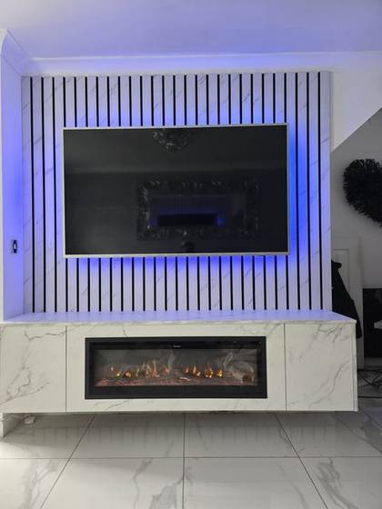 White marble slat wall with blue LED backlight and log-effect fire column