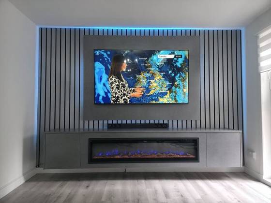 TV mounted on the wall with hidden cables and LED backlight