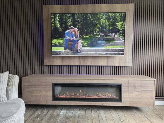 Oak media wall with dark slatted backdrop and wide log-effect electric fire